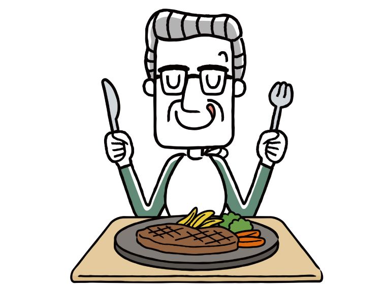 ステーキを食べようとしている高齢者の男性