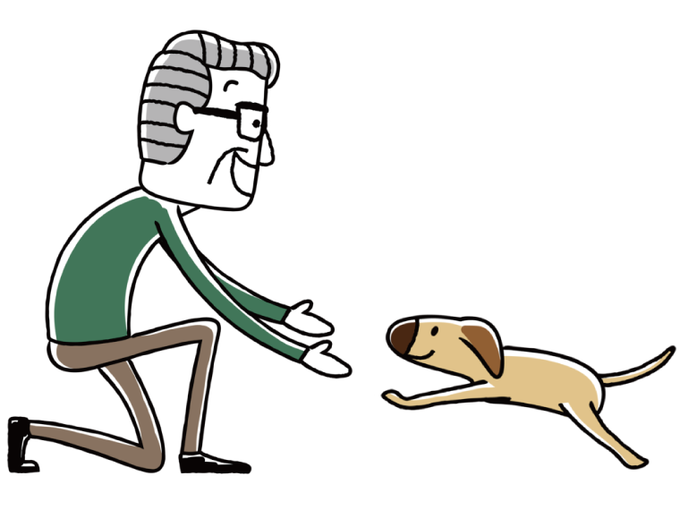 犬を抱きかかえようとしている高齢男性