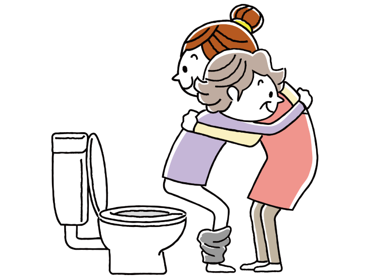 トイレ介助を行う介護職員