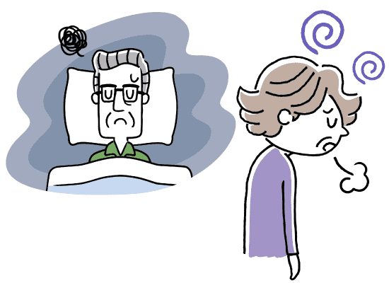 憂鬱そうにため息をつく高齢女性となかなか眠れずにいる高齢男性