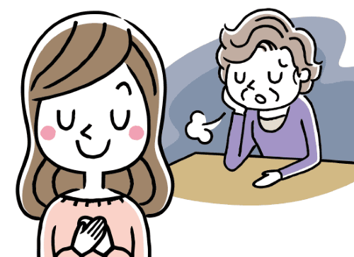 落ち込んで深いため息をつく高齢女性と胸に手を当てた若い女性
