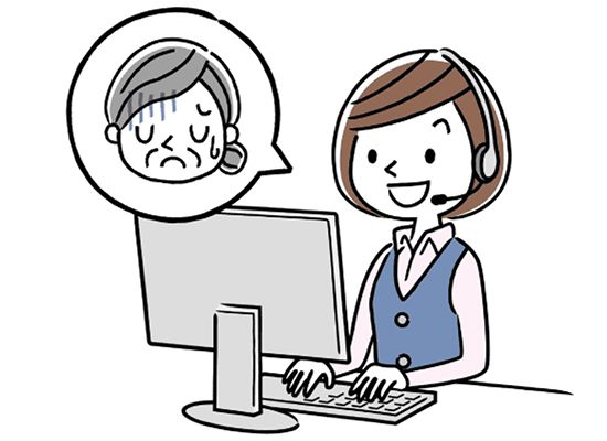 落ち込んでいる高齢女性と話をするオペレーターの若い女性