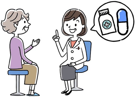 高齢女性に薬の話をする薬剤師