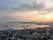 夕暮れの瀬戸内海。フェリーが港町に帰ってきている様子。