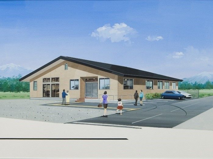 平屋建ての建物。ホームの前には駐車スペースがあり、車が止まっている。