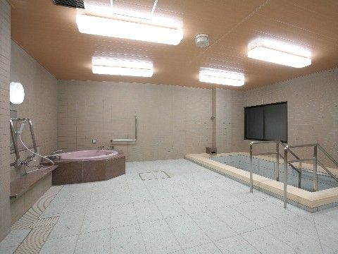 ２種類の浴槽が備え付けられたタイル張りの大きな浴室である。広い洗い場が設けられており、鏡の両サイドには銀色の手すりが取り付けられている。