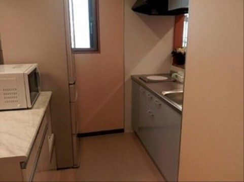 「おおぜの郷」の居室・キッチン。電子レンジも設置され、冷凍食品の解凍もできる。