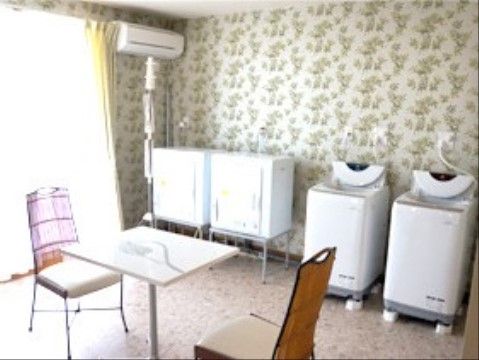 カミングホーム瑞穂の洗濯室。他人を気にせず、自宅のように洗濯ができます。好きなタイミングでお洗濯ください。