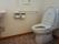 グループホーム ゆう希苑 花見川のトイレ。手すりを配備したバリアフリー設計のトイレとなっております。