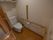 居室内のトイレは１人でご利用されることを想定し、壁に設置された手すりや非常ボタンなどの設備を充実させている。