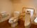 ニチイケアセンター仙台若林の共用トイレ。手すりが完備された完全バリアフリー設計のトイレとなっております。