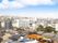 グループホームから望むことのできる風景である。住宅街が広がっており、写真中心部には木々がたくさんある。
