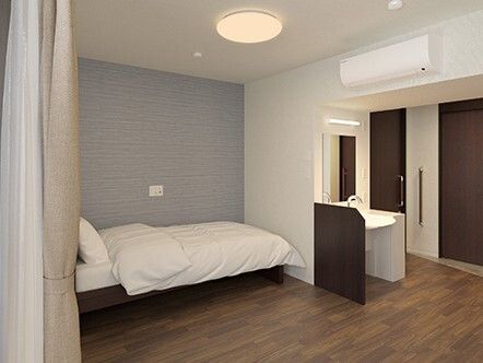 「アプルール材木座」の居室。介護ベッドは、リクライニング電動機能が設置されている。