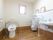 男性用と洋式トイレがある。換気窓がつけられている。床はフローリングとなっており、安全性が高くなっている。
