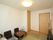 フローリング部屋に畳マットが敷かれてある。和風のテーブル、椅子が置かれている。居室の扉は引き戸式仕様。