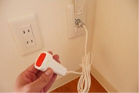 壁に設置された呼び出しボタン