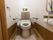 居室のトイレはウォシュレット付きホット便座、立ち座りに便利な手すりが設置してあり、ナースコールもついている。