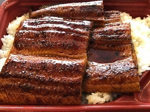 タレのかかったうな丼の弁当
