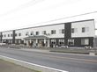 施設は道路に面した場所に建っている。2階建ての建物で、外階段がついている。施設の前に、駐車スペースがある。