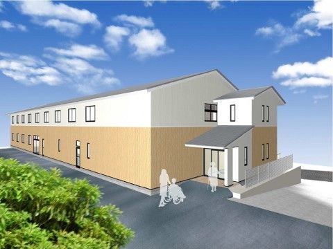 施設は2階建てである。玄関入口には黒い屋根が設置されている。手すりが取り付けられたゆるやかなスロープもある。