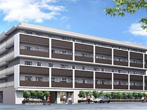 １階には樹木が建物に沿って植えられており、中が見えないよう配慮されている。ベランダ部分が茶色でシックなデザインである。