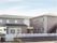 地上2階建ての施設建物を外から見た様子。周囲の環境に馴染む集合住宅のようなつくりとなっている。建物の外に非常階段がついている。