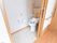 居室を入ってすぐの場所に手すりが取り付けられている。トイレにはスライド式ドアが設置され、トイレ内にも手すりがある。