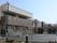 「そんぽの家 仙台中田」の外観。田園、川、海が近くにあり自然に恵まれた環境に佇む3階建ての施設。