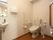 手洗い場を完備したトイレを設置している。L字形や可動式の手すりがあり、入居者様の立ち座りをサポートする。