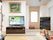 畳の部屋にテレビを備えた共有スペース