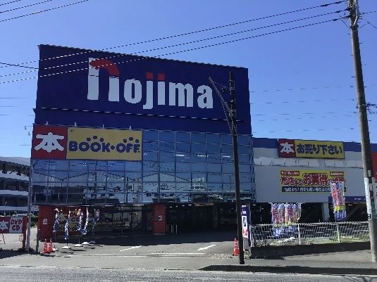ノジマ電気の建物と駐車場