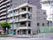 4階建ての施設の外観で、アパート型の住居施設である。目隠しフェンスがついたベランダがあり、住宅街にある。
