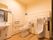 洋式トイレと男性用便器が設置されているタイプのお手洗い。それぞれの便器の周囲に手すりが設置されている。