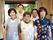男女のスタッフの笑顔あふれる写真である。ユニフォームはなく明るい柄のエプロンをかけ温かく優しい雰囲気である。