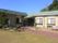 「グループホーム花平の郷」の外観。緑に囲まれた穏やかな環境。