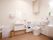 広々とした清潔感のあるトイレで、楽に座れる背もたれや収納可能な手すり、非常用ブザーの完備で安心して利用ができる。