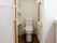 各居室に水洗トイレを設置。大きな持ち手の引き戸や壁の手すりでバリアフリーに配慮。壁面収納も設けて省スペースな設計。