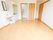 奥側から見た居室。ドアから入ってすぐのところに衣類などの収納スペース、そのとなりに個室トイレがある。