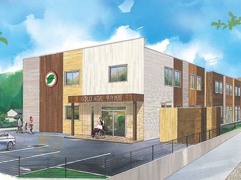 おしゃれな建物は近くに見える山々に溶け込んでいる。2階の窓には優しい景色が映り、玄関にはおしゃれな雨除けがある。