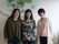 壁に掛けられたおしゃれな世界地図の前で微笑む、３名の女性スタッフ。入居者数９名の小規模施設なので、アットホームな雰囲気作りに努めている。