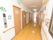 廊下にはトイレが完備されている。壁には、レクリエーションでの思い出の記念写真や作品がレイアウトされている。