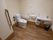 広々とした明るい清潔感のあるトイレである。温水洗浄便座や洗面スペース、ナースコール、手すりが完備されている。
