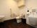 共有のトイレは多目的使用できるように、個室内に洗面台や洗浄台を設置している。入居者様の状況に応じて利用することができる。