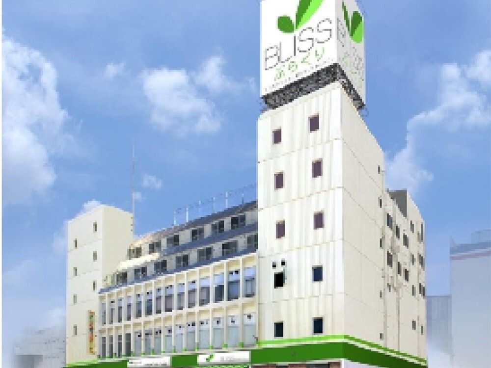 街中に建っている白い大きな建物。建物の一番上にホーム名が書かれていてよく目立つ。