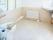 広いフローリングのトイレには手すりが付き、手洗い場もある。