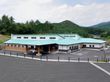 緑に囲まれた建物外観