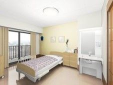 奥行きのある優しい色合いのベッドが配置されている。室内の一角には大きめの洗面台が整えられているほか、隣には収納用の棚が複数並んでいる。