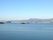 晴れた日の海。遠くに町や海が見える。