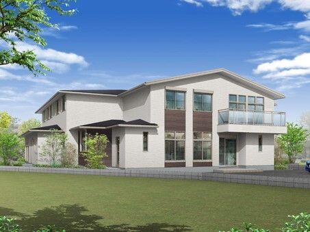 緑に囲まれた白を基調とした2階建ての建物。三角屋根が付き、アットホームな雰囲気。2階部分にはテラスがあり、駐車スペースもある。