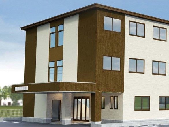 ３階建ての建物には窓がたくさんあり、ブラウンと白で温かい雰囲気。